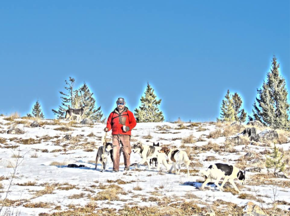 a person standing on top of a snow covered field